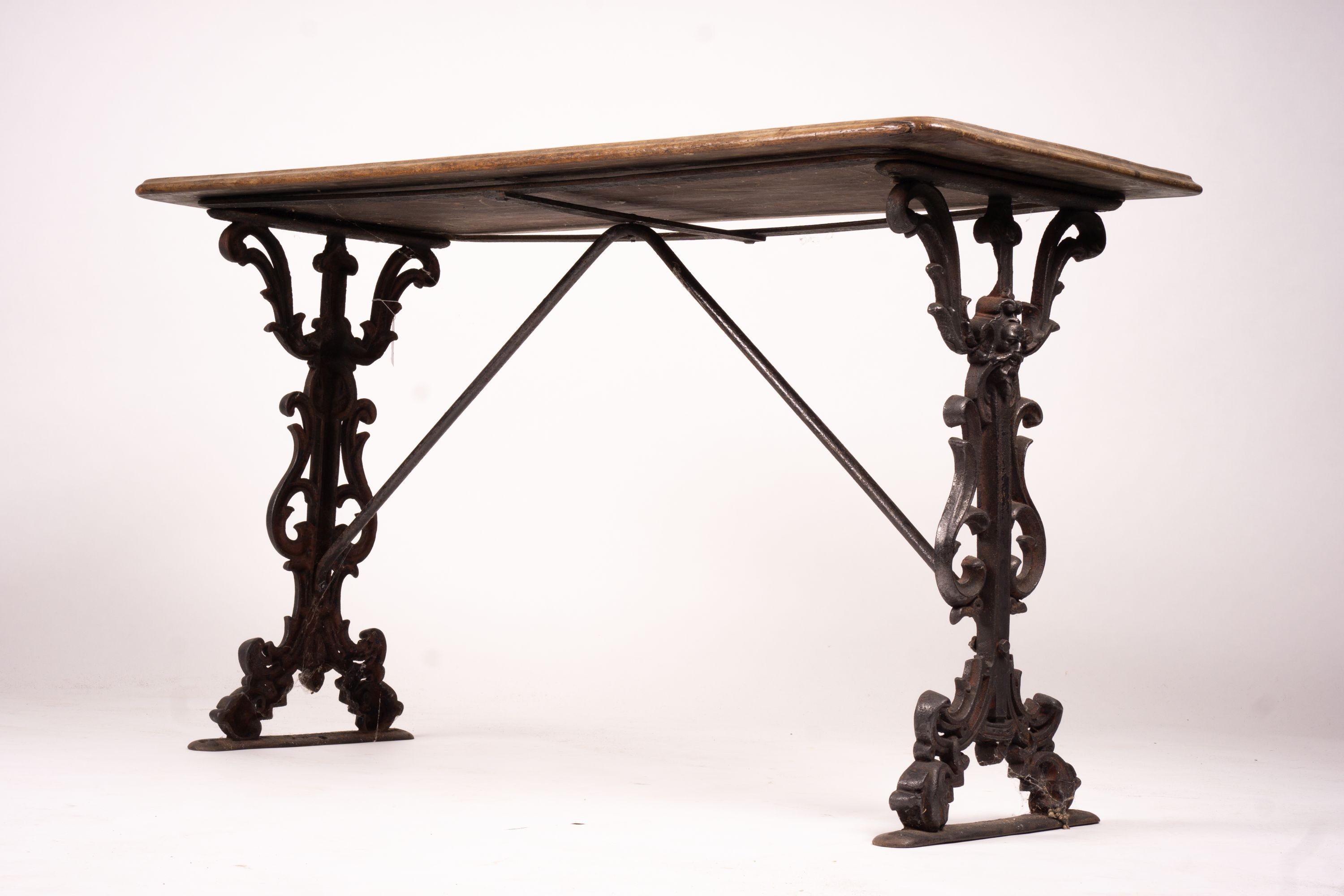 A Victorian style rectangular mahogany and cast iron tavern table, width 120cm, depth 52cm, height 69cm